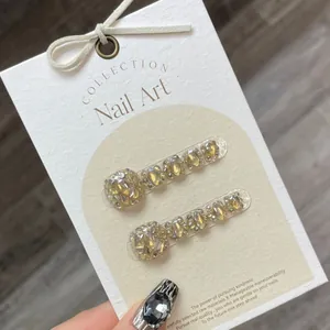 Champagne diamond press-on toenails on a collection display card for elegant pedicure