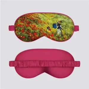 Detail of Monet silk eye mask showing Claude Monet Poppy Field print and pink satin texture