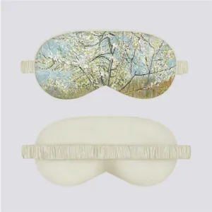 Detail of silk sleep mask featuring Monet style floral print and soft elastic strap