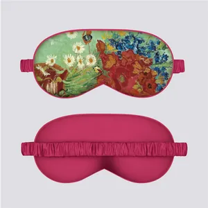 Detail view of Monet style floral silk eye mask with pink satin lining and elastic strap