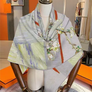 Artistic oil painting style silk wool blend scarf on mannequin with luxury orange accents