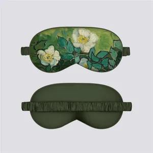 Detail of Van Gogh Wild Roses silk sleep mask showing front print and green elastic strap