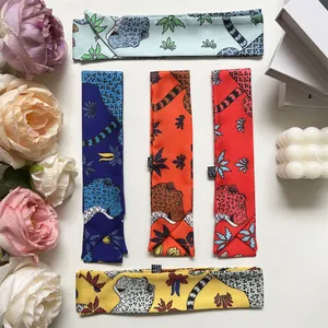 Detailed macro view of colorful leopard print silk ribbons for handbags and hair styling
