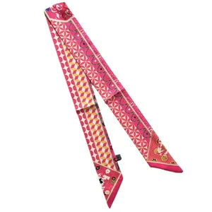 Pink narrow long silk scarf with floral geometric patterns and pointed ends on white background