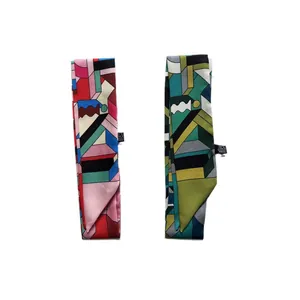 Narrow silk scarves with geometric block patterns in warm and cool color tones