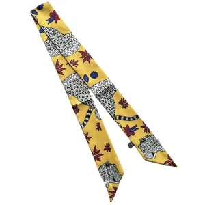 Yellow leopard print narrow silk scarf twilly with floral patterns on white background