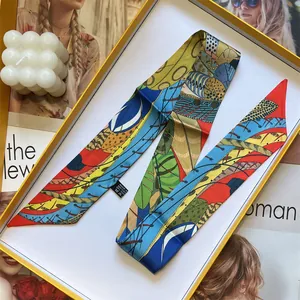 Colorful patterned silk twilly scarf for women displayed in an elegant gift box set