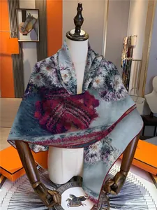 Detailed shot of floral print silk scarf featuring Monet style lilies and rolled edges