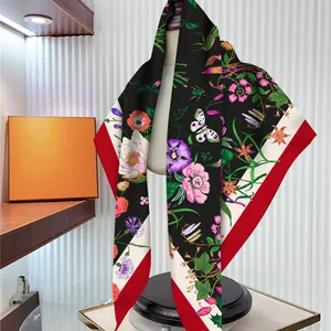 Elegant floral silk scarf for women featuring botanical patterns and red border accent