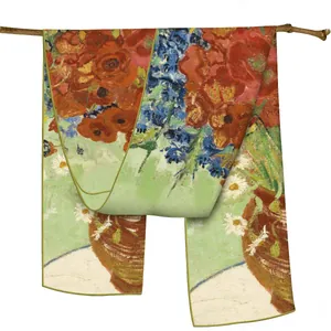 Silk scarf with Van Gogh oil painting floral print draped on a wooden branch