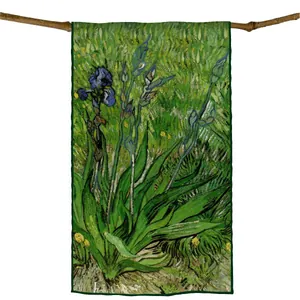 Artistic rectangle silk scarf with iris flower print hanging on a natural wooden branch