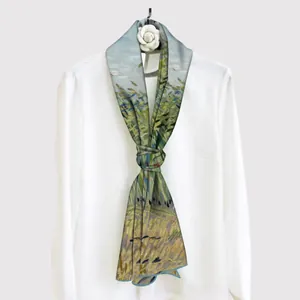 Artistic rectangular silk scarf with Van Gogh wheat field print on a white shirt