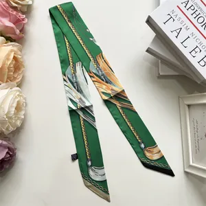 Macro detail of dark green polyester silk Twilly scarf with elegant equestrian print
