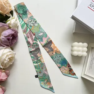 Detail of French vintage green silk twilly scarf with zebra and floral jungle print