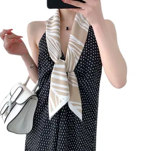 Elegant beige silk-like scarf with white stripes styled for professional business attire