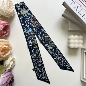 Macro detail of twilly scarf with abstract bird prints and high-quality edge stitching