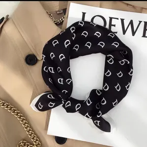 Elegant satin square scarf with white D-letter print and black contrast border