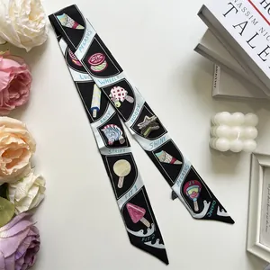 Silk twilly scarf with cartoon ice cream print styled with flowers and books