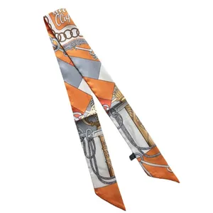 Orange and grey equestrian print narrow silk scarf with cliq lettering on white background