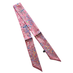 Pink narrow silk scarf with colorful abstract prints on white background