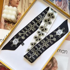 Blue and white printed twilly silk scarf in a premium gift box with fashion elements