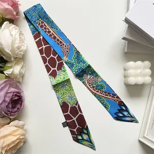 Detail of giraffe print silk scarf with floral patterns and 100% polyester wash label