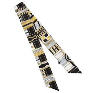 Foulard twilly étroit en soie avec motifs géométriques noir et or pour cheveux ou sacs