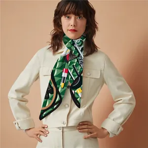 Detail of silk-feel 90cm square scarf featuring green fashion prints and makeup motifs