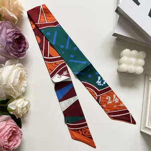 Narrow silk twilly scarf with geometric print and colorful blocks for hair and bags