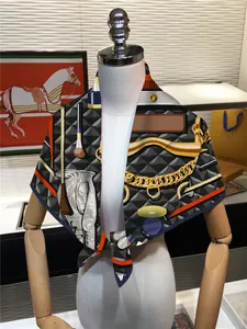 Detail of elegant 90cm square silk scarf featuring equestrian motif on a white mannequin