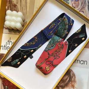 Baroque style silk twilly scarf with gold chain patterns in an elegant gift box