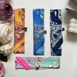 Detail of four colorful paisley silk scarves with 100% polyester fabric material