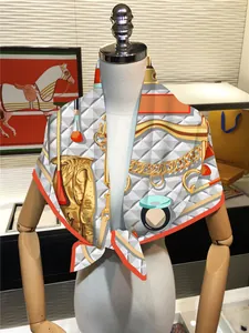 Detail of a luxury 90cm square silk scarf with horse harness patterns on a white mannequin