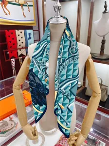 Detail of silk-feel scarf with equestrian horse motifs and chain patterns tied on a mannequin