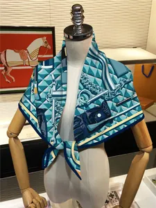 Detail of silk-feel scarf with equestrian horse bit prints on a wooden mannequin arm