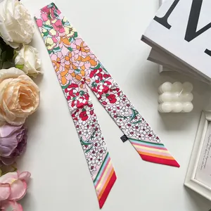 Detailed view of floral silk-feel polyester twilly scarf with rainbow stripe accent