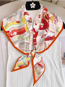 Detail of printed silk scarf tied on top featuring sea creatures and coral patterns