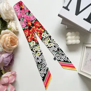Floral twilly scarf with pink and orange flowers and colorful striped tapered ends