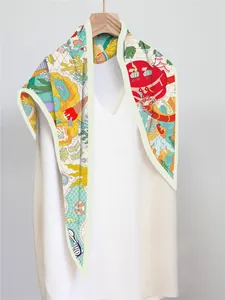Close-up of summer silk scarf with crab and ocean motifs on a white dress