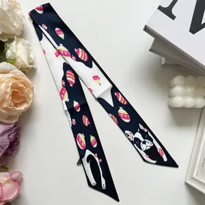 Detail view of double-sided silk ribbon with Boston Terrier and festive patterns
