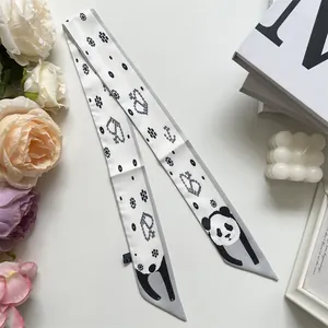 Detailed view of panda print skinny silk scarf with polyester washing label info