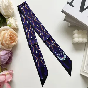 Detail of navy blue twilly scarf with roaring tiger pattern and star accents on white