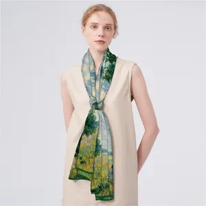 Elegant double-sided landscape art print silk scarf worn with a beige summer dress