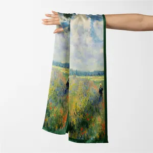 Artistic silk scarf with Monet Poppy Field print draped elegantly on a white background