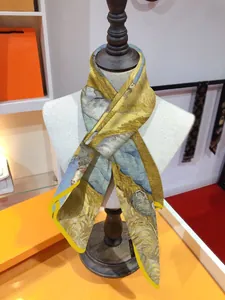 Detail of Van Gogh Wheat Field oil painting silk scarf tied on a beige mannequin
