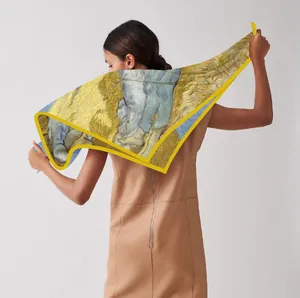 Detail of Van Gogh Noon Rest art print on large silk scarf worn as a stylish shawl
