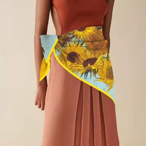Detail of Van Gogh sunflower silk scarf worn as a stylish waist wrap accessory