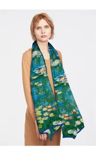 Close-up of lightweight artistic scarf with Monet Water Lilies print and blue hem detail