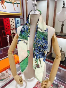 Artistic Van Gogh Iris printed 90cm square silk scarf on a wooden mannequin display