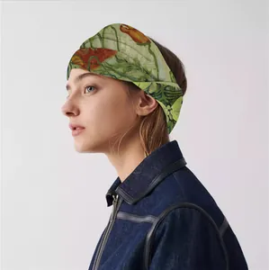 Detail of vintage oil painting floral wide headband worn by a model in profile